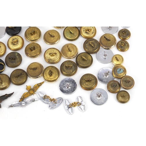 428 - British military World War I and later Royal Air Force militaria comprising cap badges, pips and lap... 