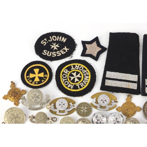 604 - St John Ambulance memorabilia including badges, buttons and cloth patches