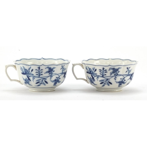 461 - Five Meissen fluted cups and saucers hand painted in the Blue Onion pattern, crossed sword marks to ... 