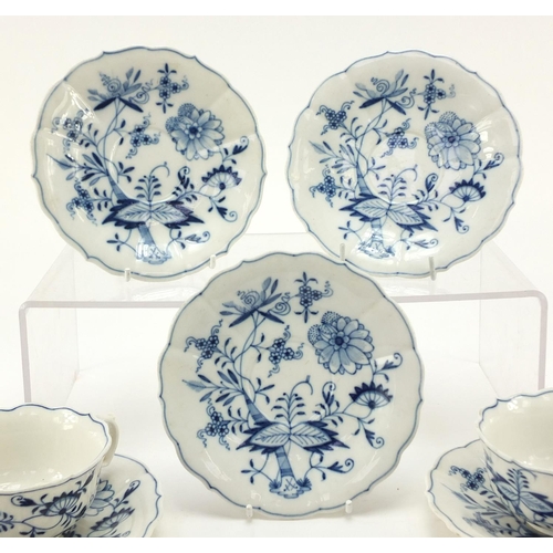 461 - Five Meissen fluted cups and saucers hand painted in the Blue Onion pattern, crossed sword marks to ... 