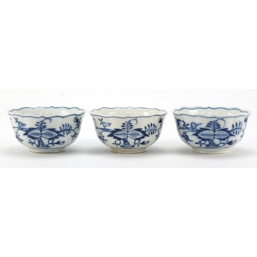 461 - Five Meissen fluted cups and saucers hand painted in the Blue Onion pattern, crossed sword marks to ... 