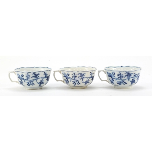 461 - Five Meissen fluted cups and saucers hand painted in the Blue Onion pattern, crossed sword marks to ... 