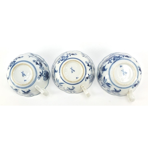 461 - Five Meissen fluted cups and saucers hand painted in the Blue Onion pattern, crossed sword marks to ... 