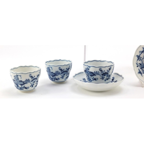 464 - Five Meissen fluted cups with saucers and two additional saucers each, each hand painted in the Blue... 