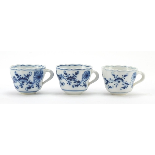 464 - Five Meissen fluted cups with saucers and two additional saucers each, each hand painted in the Blue... 