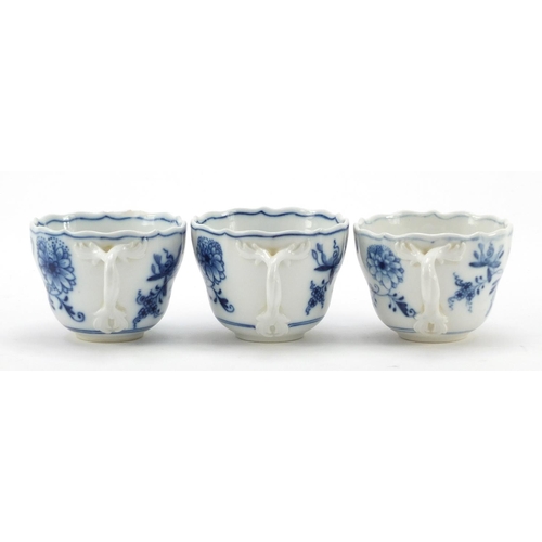 464 - Five Meissen fluted cups with saucers and two additional saucers each, each hand painted in the Blue... 