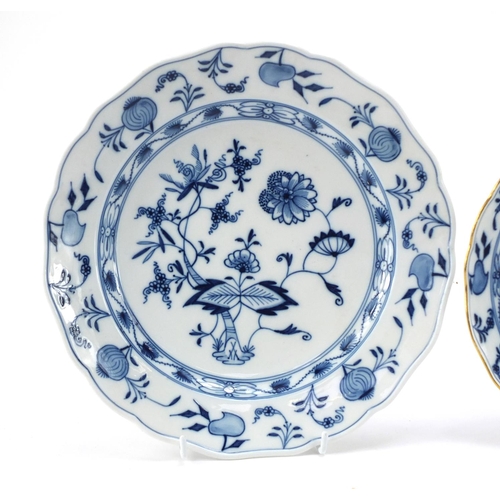 459 - Two Meissen plates and a shallow bowl, each hand painted in the Blue Onion pattern, crossed sword ma... 