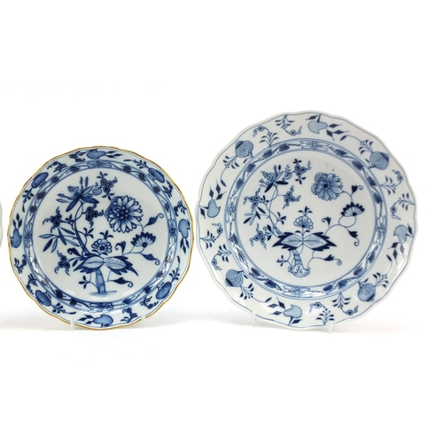 459 - Two Meissen plates and a shallow bowl, each hand painted in the Blue Onion pattern, crossed sword ma... 