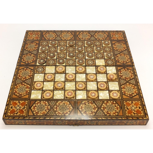 902 - Moorish style Syrian inlaid folding games board with draughts, 50cm x 50cm
