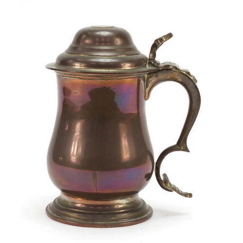 116 - 18th century copper tankard inset with a 1723 silver shilling, 20cm high