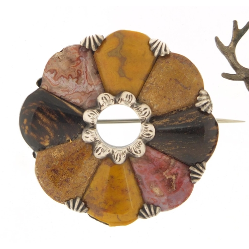 366 - Three Scottish hardstone brooches including a silver dirk, the largest 4.5cm in diameter