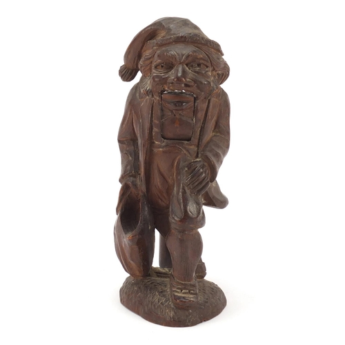 190 - Pair of carved Black Forest nutcrackers in the form of a 
 man, 21cm high