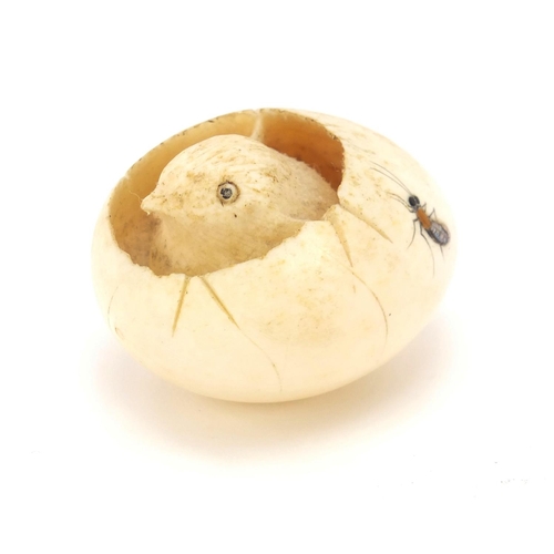 75 - Japanese Shibayama carved ivory chick hatching from an egg, inlaid with insects, 5cm wide