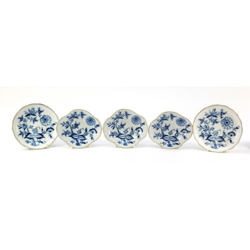 94 - Meissen porcelain hand painted in the blue onion pattern comprising two fluted cups with saucers, tw... 