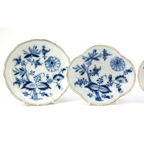 94 - Meissen porcelain hand painted in the blue onion pattern comprising two fluted cups with saucers, tw... 