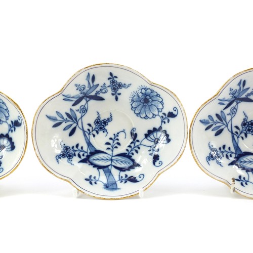 94 - Meissen porcelain hand painted in the blue onion pattern comprising two fluted cups with saucers, tw... 