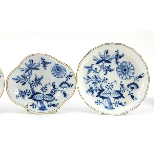 94 - Meissen porcelain hand painted in the blue onion pattern comprising two fluted cups with saucers, tw... 