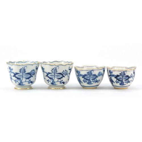 94 - Meissen porcelain hand painted in the blue onion pattern comprising two fluted cups with saucers, tw... 