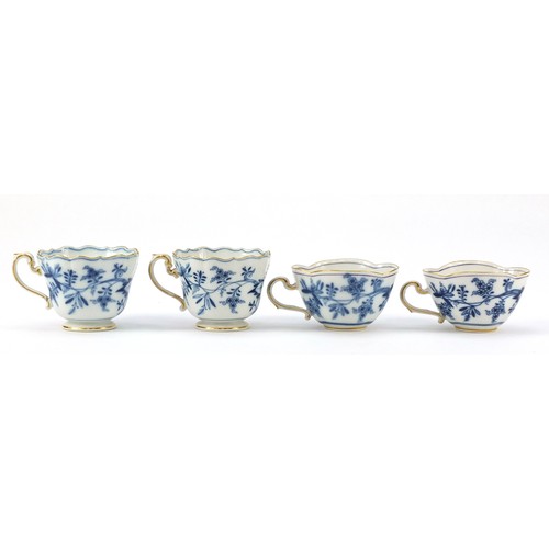 94 - Meissen porcelain hand painted in the blue onion pattern comprising two fluted cups with saucers, tw... 