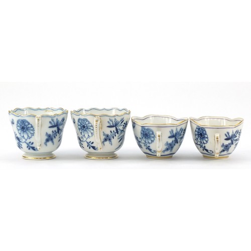 94 - Meissen porcelain hand painted in the blue onion pattern comprising two fluted cups with saucers, tw... 