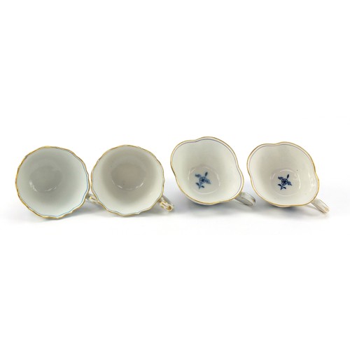 94 - Meissen porcelain hand painted in the blue onion pattern comprising two fluted cups with saucers, tw... 