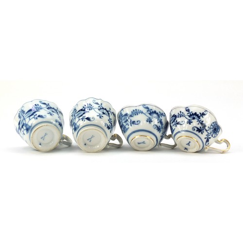 94 - Meissen porcelain hand painted in the blue onion pattern comprising two fluted cups with saucers, tw... 