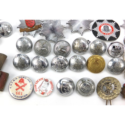 602 - Collection of vintage and later fire and police badges, pips and helmet plates