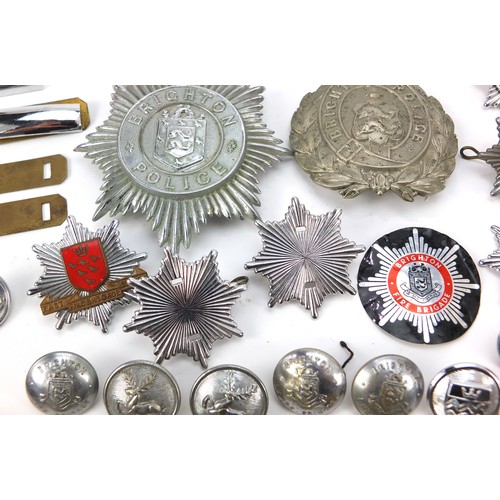 602 - Collection of vintage and later fire and police badges, pips and helmet plates