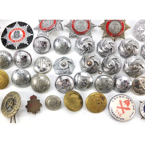 602 - Collection of vintage and later fire and police badges, pips and helmet plates