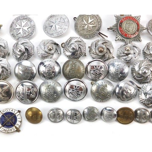 602 - Collection of vintage and later fire and police badges, pips and helmet plates