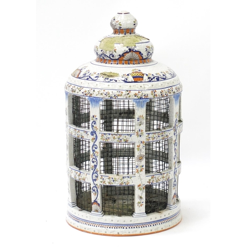 469 - Large Italian faience glazed pottery bird cage, painted with flowers, 60cm high