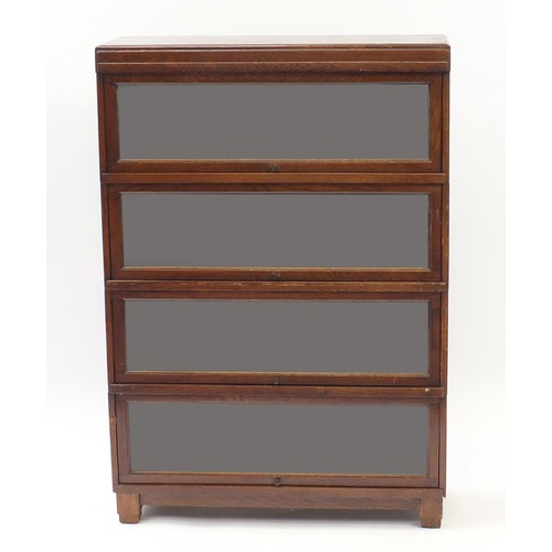 2064 - Globewernicke oak four section glazed bookcase, 114cm H x 85cm W x 28.5cm D