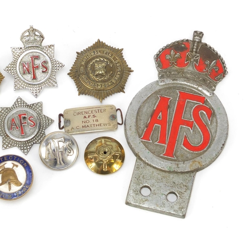 601 - Fire Brigade memorabilia including badges, buttons and a Auxiliary Fire Service car badge