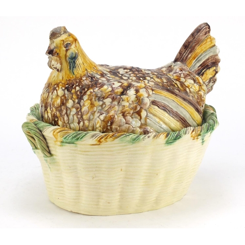 88 - Antique hand painted pottery tureen cover in the form of a chicken on a basket, 25cm high x 30cm wid... 