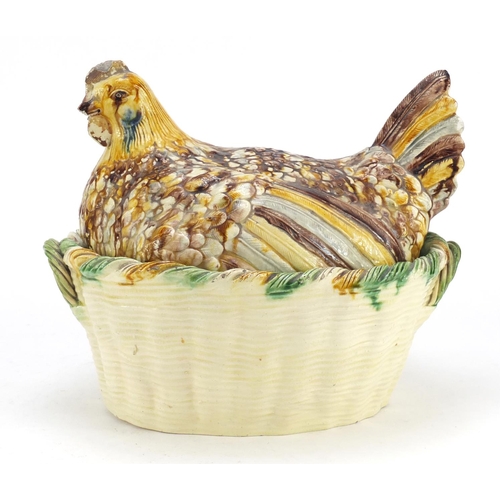 88 - Antique hand painted pottery tureen cover in the form of a chicken on a basket, 25cm high x 30cm wid... 