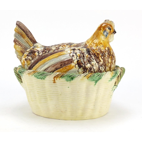 88 - Antique hand painted pottery tureen cover in the form of a chicken on a basket, 25cm high x 30cm wid... 