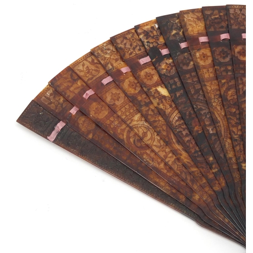 14 - Chinese Canton tortoiseshell brisé fan, finely carved with panels of pagodas amongst flowers and bir... 