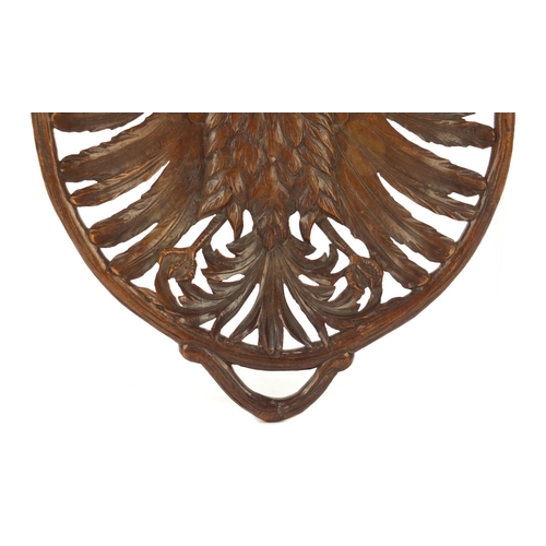 191 - Black Forest basket with twin handles finely carved with a winged eagle, 36.5cm wide