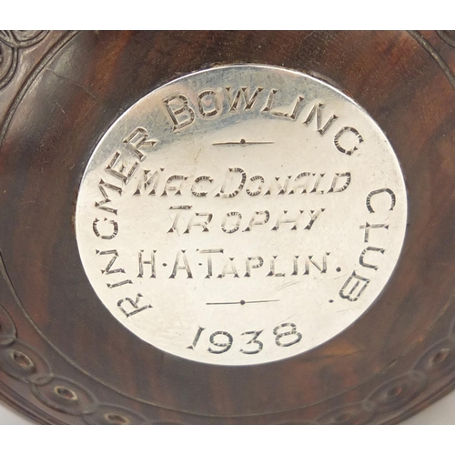 192 - Two lignum vitae presentation bowls on stands by Taylor-Rolph of London, each with inset silver plaq... 