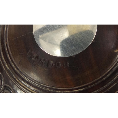 192 - Two lignum vitae presentation bowls on stands by Taylor-Rolph of London, each with inset silver plaq... 