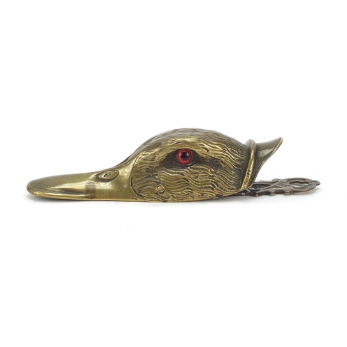 196 - Victorian engraved brass letter clip in the form of a ducks head with beaded glass eyes, 15.5cm in l... 