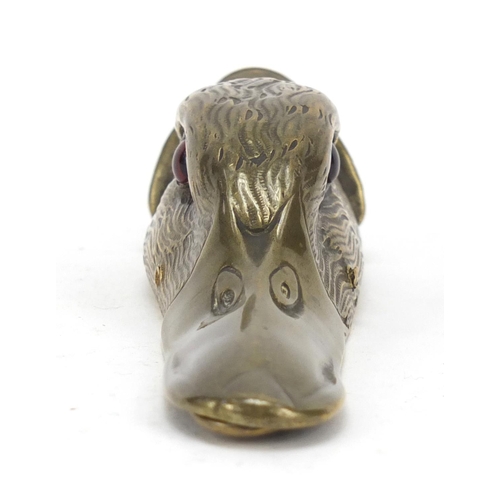 196 - Victorian engraved brass letter clip in the form of a ducks head with beaded glass eyes, 15.5cm in l... 