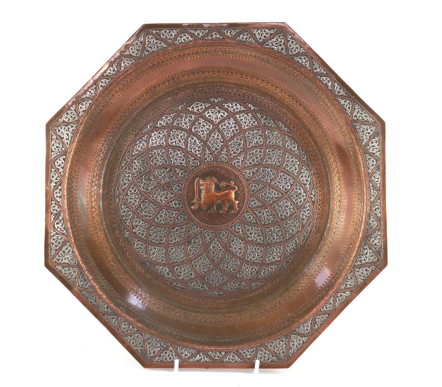 Burmese copper tray embossed with a mythical dragon and having