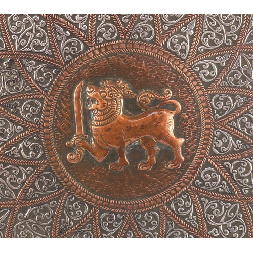 Burmese copper tray embossed with a mythical dragon and having