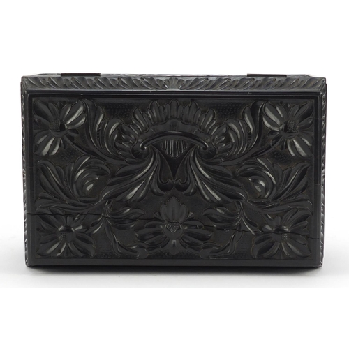 319 - Anglo Indian Ceylonese ebony casket profusely carved with flowers, 11.5cm H x 24cm W x 15.5cm D