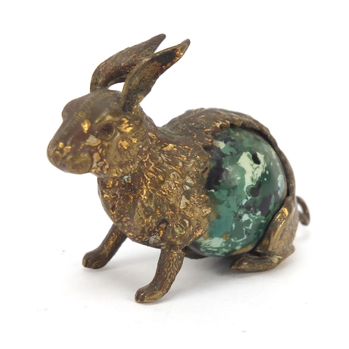 42 - Early 20th century sewing interest brass and Bakelite tape measure in the form of a hare, 4.5cm high