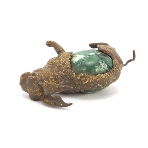 42 - Early 20th century sewing interest brass and Bakelite tape measure in the form of a hare, 4.5cm high
