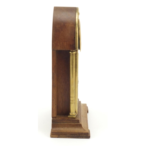 130 - Oak and brass Secessionist mantle clock with columns and Arabic numerals, 23cm high