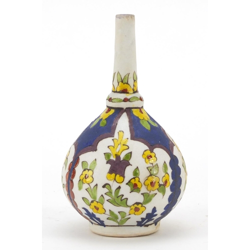 246 - Early Islamic pottery rosewater gulaptan hand painted with flowers, 15.5cm high