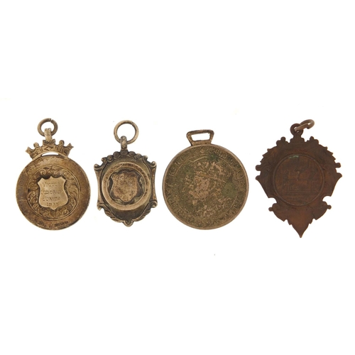 1539 - Three sports jewels and a commemorative medallion including two silver